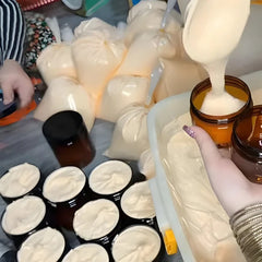 Zaafraan Cream in black jar with saffron on a wooden surface (200g)