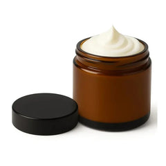 Zaafraan Cream in black jar with saffron on a wooden surface (200g)