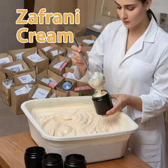 Zaafraan Cream in black jar with saffron on a wooden surface (200g)